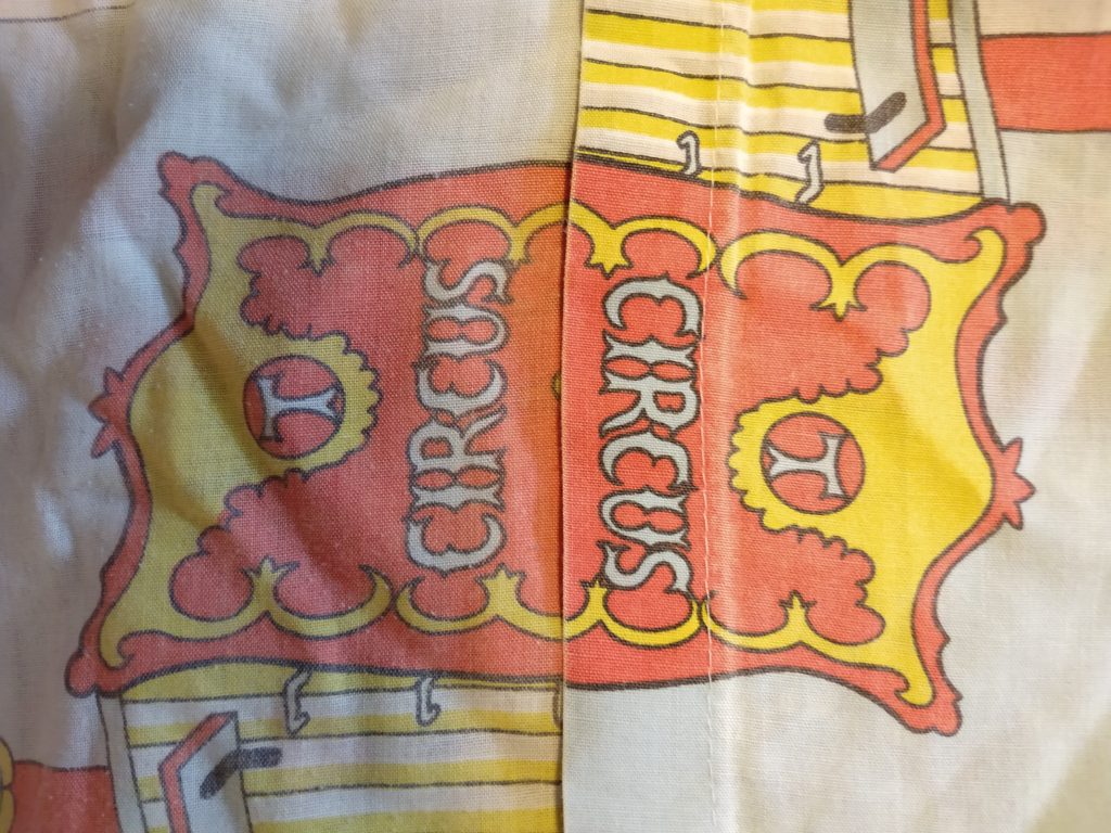 the difference in where the fabric of a tom & jerry duvet cover has faded over the years